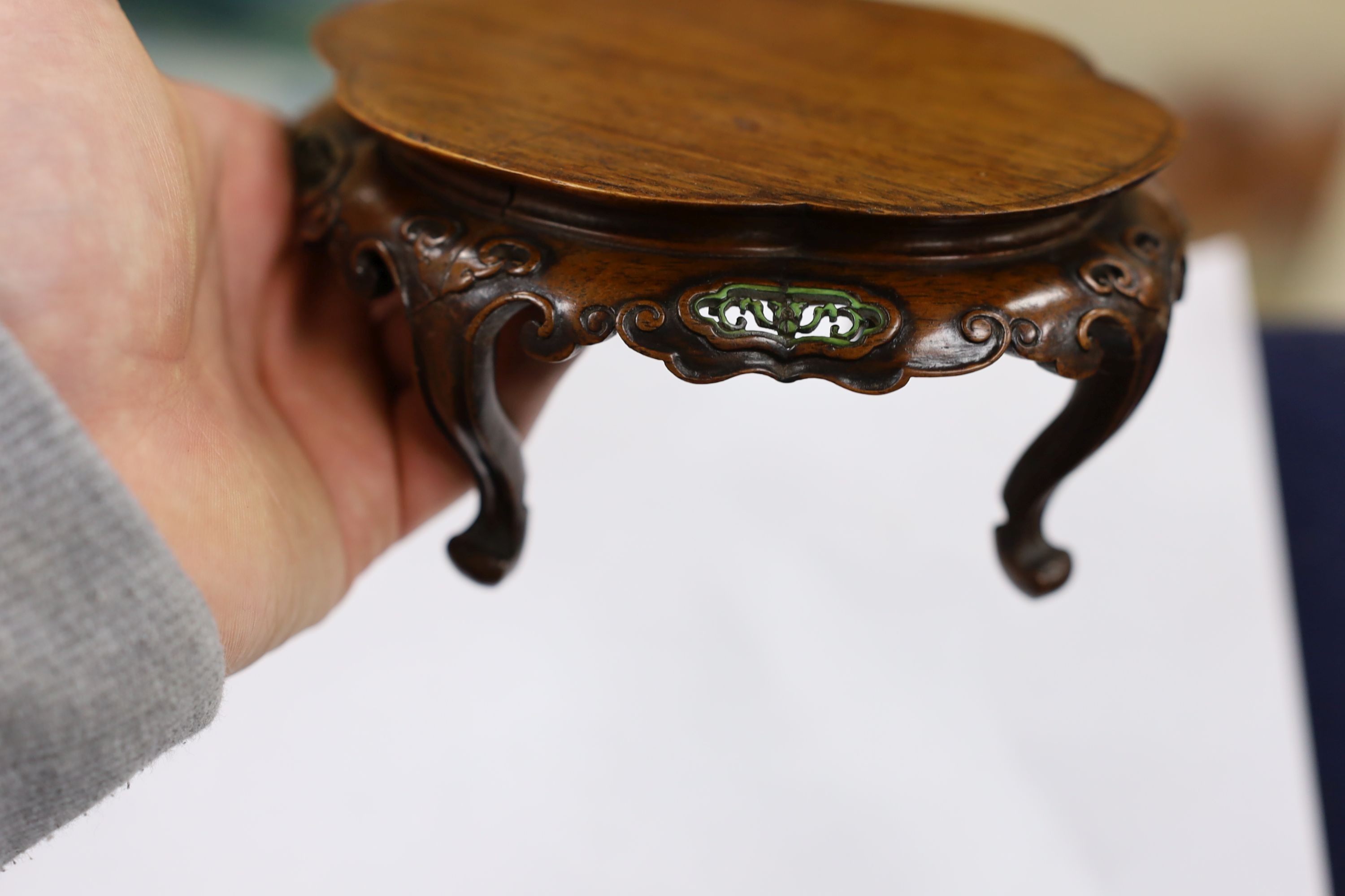 A fine Chinese oval hardwood and green stained Ivory inset stand, Qing dynasty, lacking stretcher, 15 cms wide.